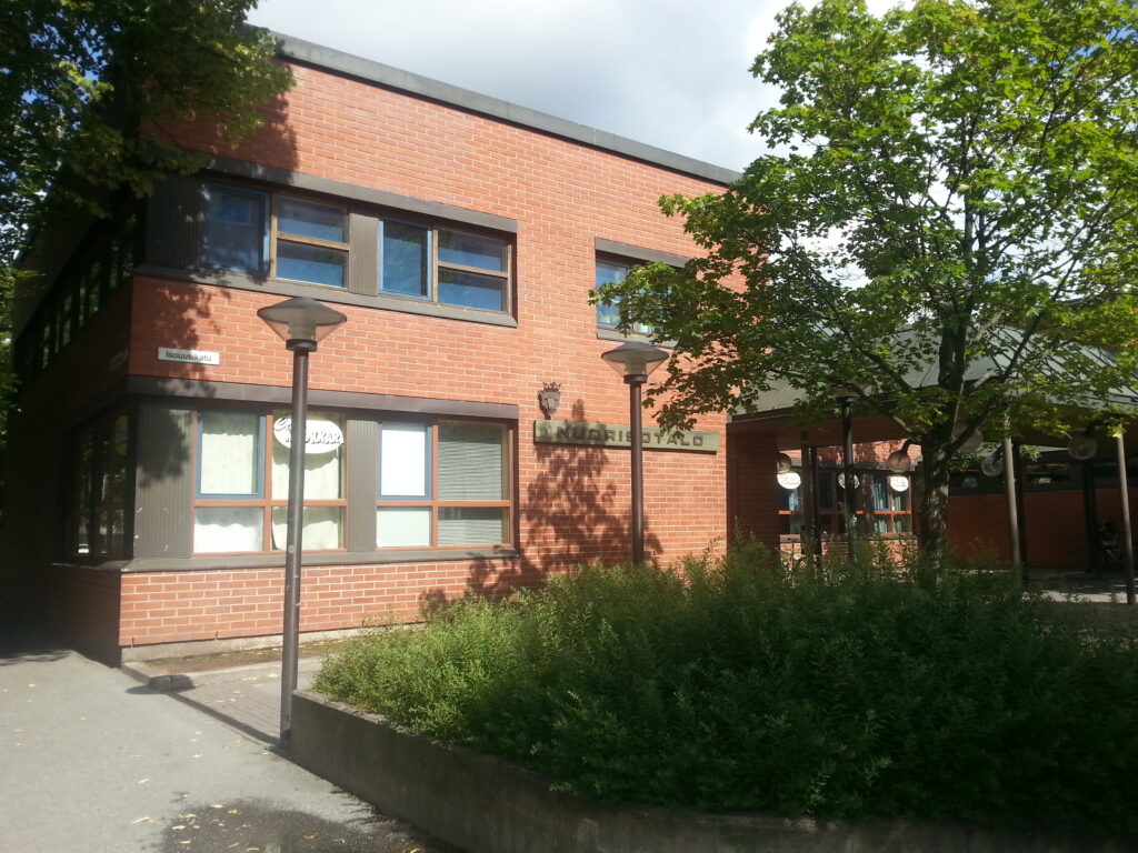 The picture shows a red brick house.