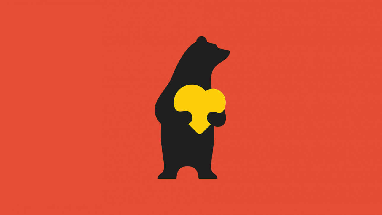 Porin brändinmukainen karhu, jolla käsissä keltainen sydän