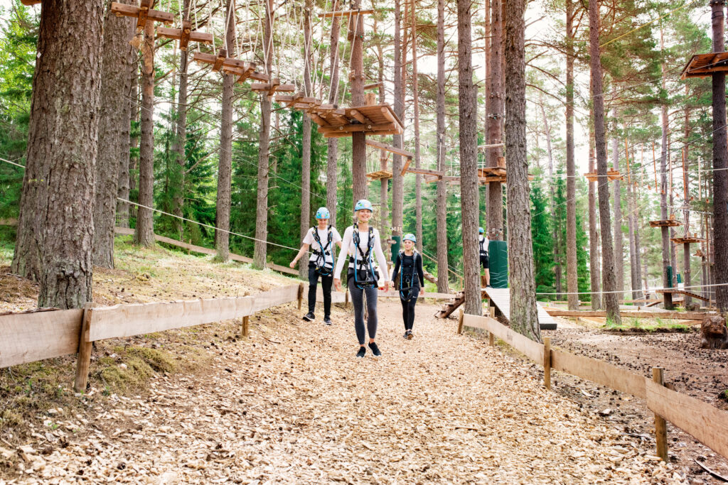 Family walks in an adventure park